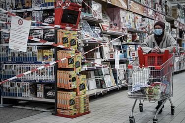 A customer passes the closed toy department of a supermarket in Bordeaux on November 4. Supermarkets in the country have banned the sale of 'non-essential products'. AFP