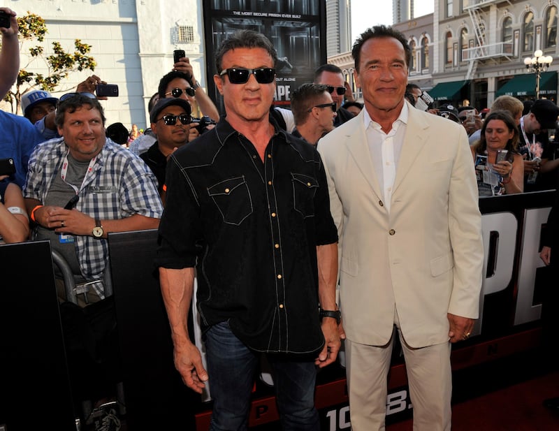 Sylvester Stallone, left, and Arnold Schwarzenegger arrive at the "Escape Plan" special screening on Day 2 of Comic-Con International on Thursday, July 18, 2013 in San Diego, Calif. (Photo by Chris Pizzello/Invision/AP) *** Local Caption ***  2013 Comic-Con - Escape Plan Special Screening.JPEG-0ed10.jpg