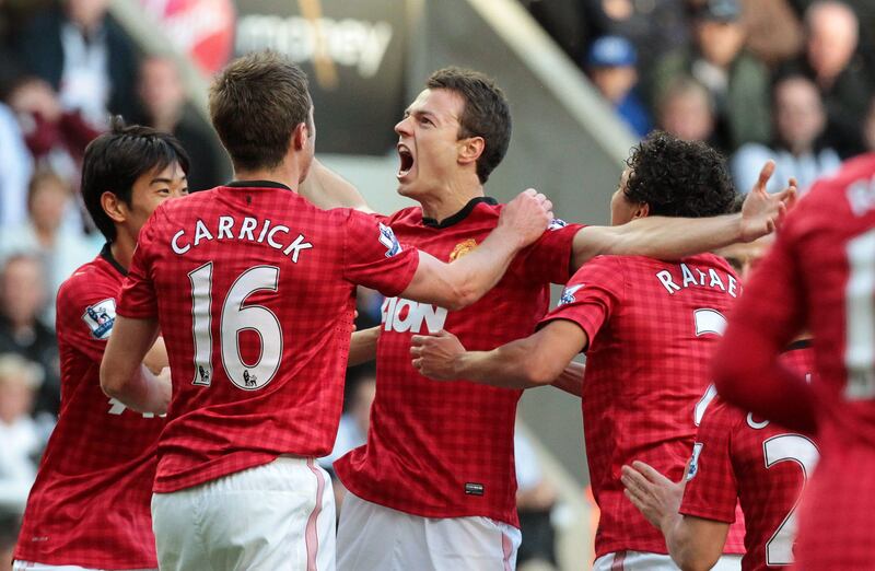 epa03424745 Manchester United's Johnny Evans (C) celebrates with his teammates after scoring the opening goal against Newcastle United during their English Premier League soccer match in Newcastle, Britain, 07 October 2012.  EPA/LINDSEY PARNABY DataCo terms and conditions apply http//www.epa.eu/downloads/DataCo-TCs.pdf *** Local Caption ***  03424745.jpg