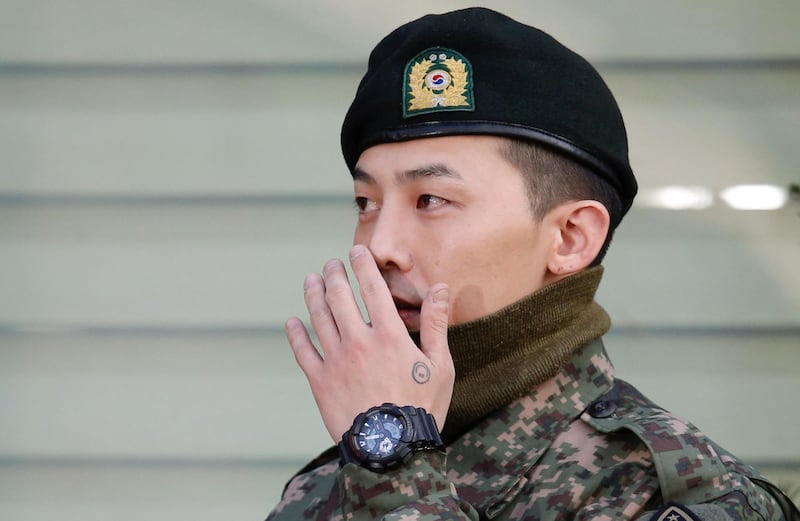 Leader of South Korean K-pop boyband Big Bang G-Dragon leaves after being discharged from army in Yongin, South Korea, October 26, 2019. REUTERS/Heo Ran