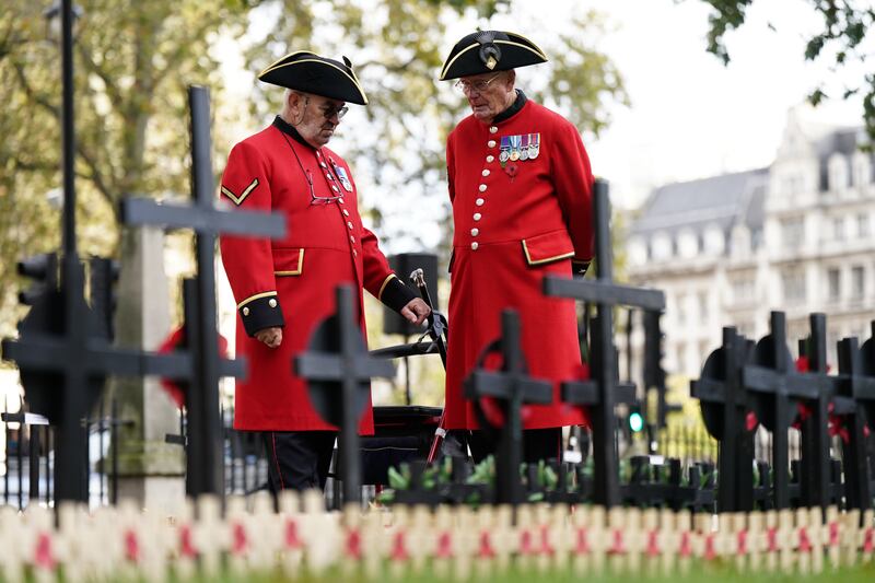 Chelsea pensioners at the Field of Remembrance at Westminster Abbey in London. PA