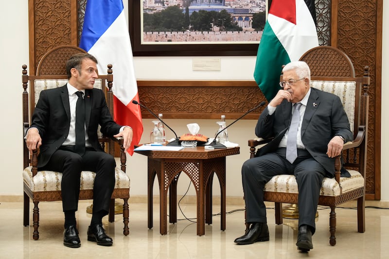 French President Emmanuel Macron, left, and Palestinian President Mahmoud Abbas attend a meeting in the occupied West Bank city of Ramallah. EPA