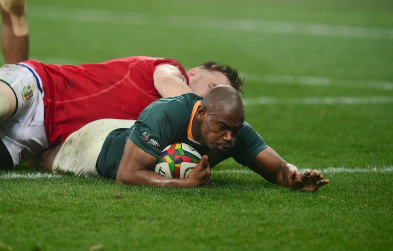 Makazole Mapimpi of South Africa scores a try on the way to a 27-9 victory for the Springboks.