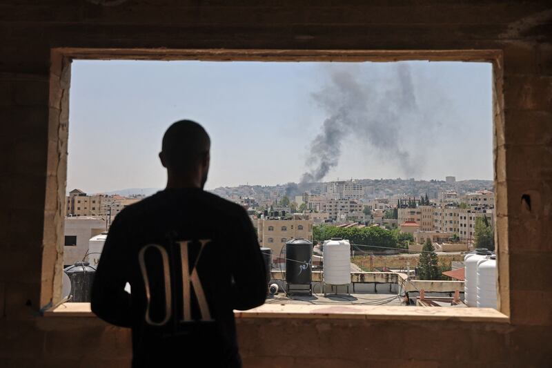 Smoke billows from an Israeli drone strike in Jenin. AFP