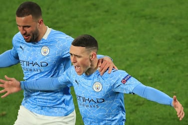 Manchester City's Phil Foden and Kyle Walker celebrate the winner against Borussia Dortmund. AFP