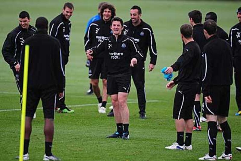 Newcastle United’s Joey Barton, centre, shares a laugh during training yesterday.
