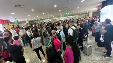 Handout photo of issued by Paul Lidwith of people listening to an Emirates member of staff (centre) whilst waiting at Dubai World Central airport because of flooding caused by the heaviest rain ever recorded in the desert nation. Mr Lidwith, a solicitor from Merseyside, who was diverted to Dubai World Central - Al Maktoum International Airport, located an hour away from Dubai International, said there is no food or water and claimed staff at Emirates had not provided information about his flight to Manchester. Picture date: Wednesday April 17, 2024. PA Photo. See PA story AIR Dubai. Photo credit should read: Paul Lidwith/PA Wire 

NOTE TO EDITORS: This handout photo may only be used in for editorial reporting purposes for the contemporaneous illustration of events, things or the people in the image or facts mentioned in the caption. Reuse of the picture may require further permission from the copyright holder. 