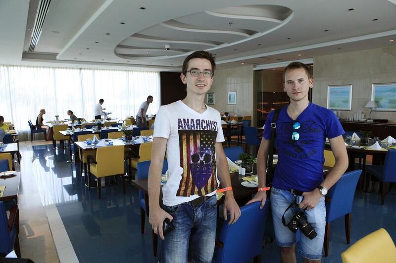 Russian tourists Vachislav Murko, left, and Stanislav Volkov at Oceanic hotel in Khor Fakkan. Sarah Dea / The National