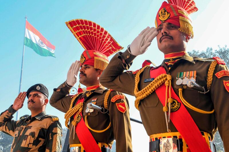 Members of the Border Security Force personnel salute during a flag ceremony to celebrate Republic Day at the India-Pakistan Wagah border post, 35 kilometres from Amritsar. AFP