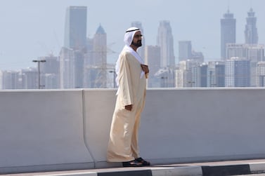 Dubai ruler Sheikh Mohammed bin Rashid Al-Maktoum watches the sixth stage of the UAE Cycling Tour From Dubai Deira Islands to Dubai - Palm Jumeriah on February 26, 2021. / AFP / Giuseppe CACACE
