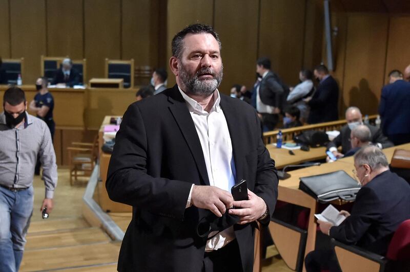 (FILES) In this file photo taken on October 12, 2020 Independent European parliamentarian MP Ioannis Lagos, a top Golden Dawn organiser who defected from the party last year in 2019, after winning a European parliament seat, leaves the courtroom in Athens. Greek MEP Ioannis Lagos, a former leading member of the neo-Nazi Golden Dawn party, was arrested in Belgium on April 27, 2021 hours after the European Parliament lifted his immunity, Greek police said. / AFP / LOUISA GOULIAMAKI
