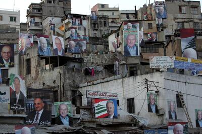Election campaign posters cover buildings in a working class neighbourhood of the northern Lebanese port city of Tripoli, as Lebanese voters cast their ballots on June 7, 2009 in a high-stakes general election pitting a Western-backed coalition against an Iranian-backed alliance led by the Hezbollah militant group. AFP PHOTO/ANWAR AMRO / AFP PHOTO / ANWAR AMRO