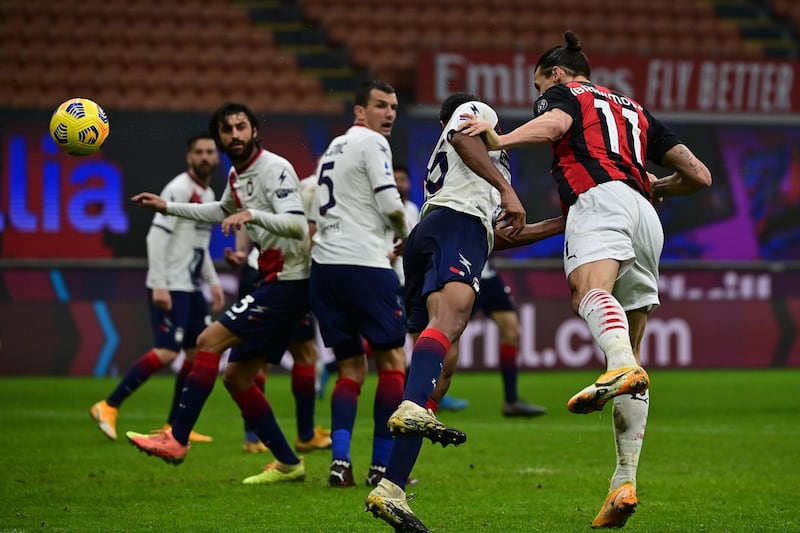 AC Milan's Zlatan Ibrahimovic heads at goal. AFP