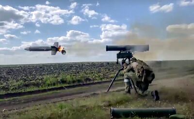 A Russian soldier fires from a Kornet, a Russian anti-tank guided missile, at an undisclosed location in Ukraine. AP Photo