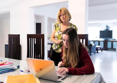 DUBAI, UNITED ARAB EMIRATES. MARCH 2020. 
Alicia and her daughter Jasmine Hol, 11. 
First day of distance learning at the Hol family’s household.
(Photo: Reem Mohammed/The National)

Reporter:
Section: