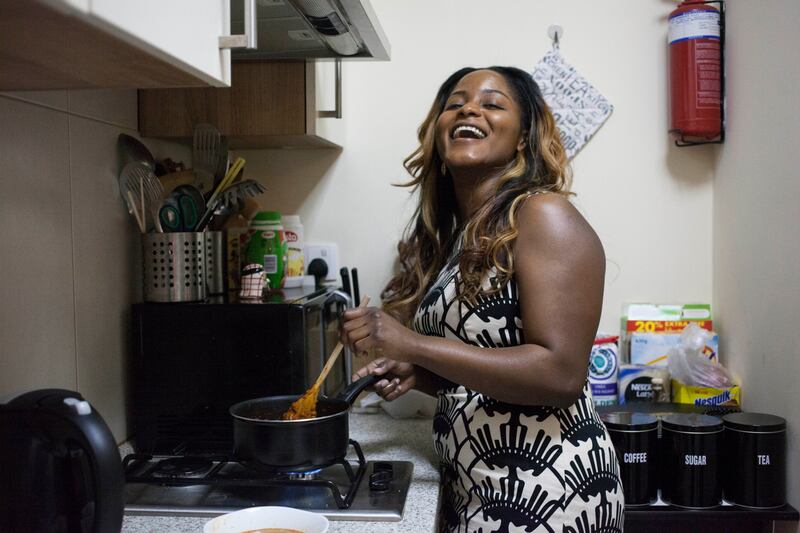 Dubai, United Arab Emirates - August 2 2015 - Yvette Kikuyu cooks a Nigerian meal known as "Pepe Gizzard" at her home in Jumeirah Village Triangle. Kikuyu has been cooking African cuisine for local users of the app Flyvr which connects home cooks to people that want their food in the area. Reporter: Afshan Ahmed. Section: Arts & Life (Razan Alzayani for The National)  *** Local Caption ***  RA_0802_flyvr_cooking__11.jpg