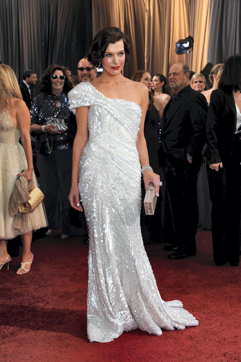 Actress Milla Jovovich arrives on the red carpet for the 84th Annual Academy Awards on February 26, 2012 in Hollywood, California. AFP PHOTO Valerie MACON (Photo by VALERIE MACON / AFP)