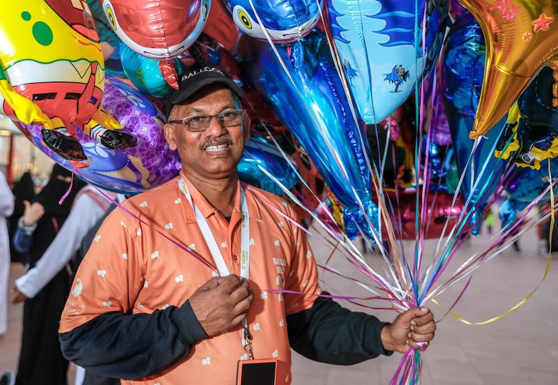 Abu Dhabi, United Arab Emirates, January 5, 2020.  
Photo essay of Global Village.
--  Mr. Ali, has been selling balloons at the Global Village for 10 years now.  He is from India.
Victor Besa / The National
Section:  WK
Reporter:  Katy Gillett