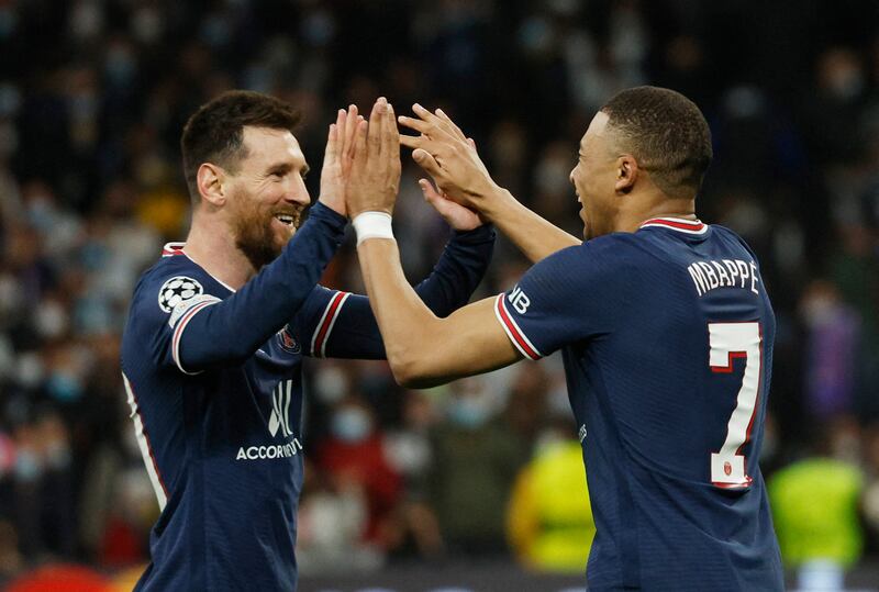 Mbappe celebrates scoring with Lionel Messi. Reuters