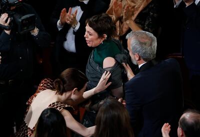 91st Academy Awards - Oscars Show - Hollywood, Los Angeles, California, U.S., February 24, 2019. Olivia Colman (C) stands to accept the Best Actress award for her role in "The Favourite." REUTERS/Mike Blake