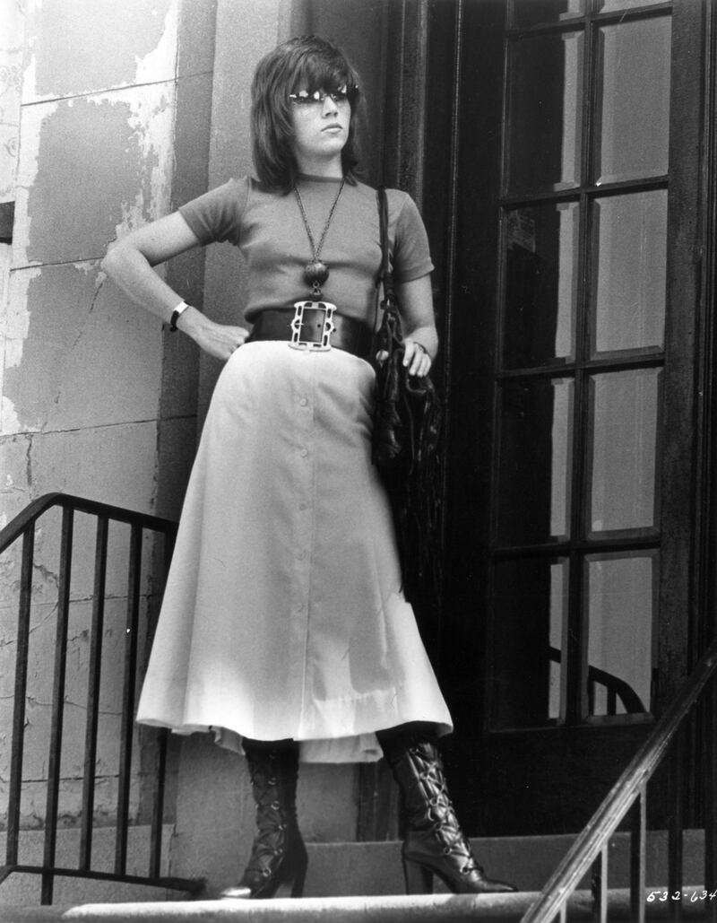 Jane Fonda, in a T-shirt and buttoned skirt, in 1971