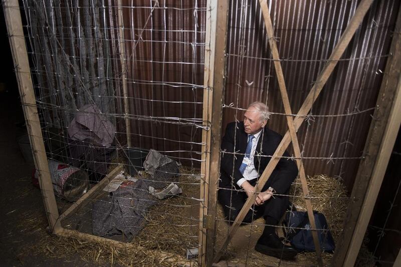 Above, a performance installation at the World Economic Forum, where participants become victims of conflict and have to support the conditions of it. Pierre Abensur / World Economic Forum