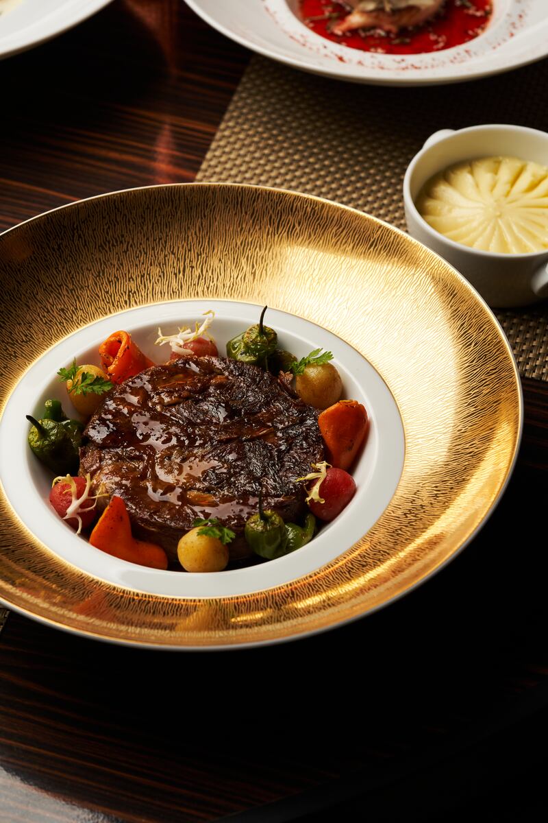 Slow-cooked lamb shoulder from the main course selection is a standout dish for iftar.