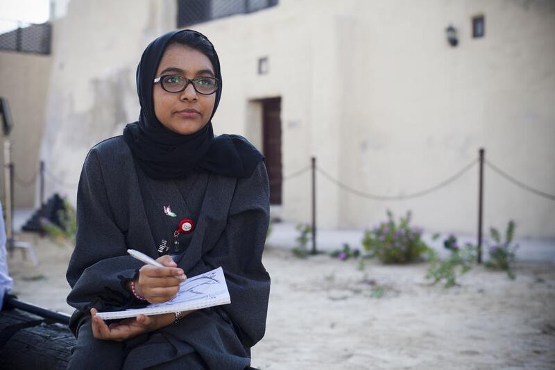 The Journey of the Union, a programme organised by Al Bayt Mitwahid, moved on to Umm Al Quwain. Seen here drawing is Sheikha Al Bayraq. Lee Hoagland/The National.