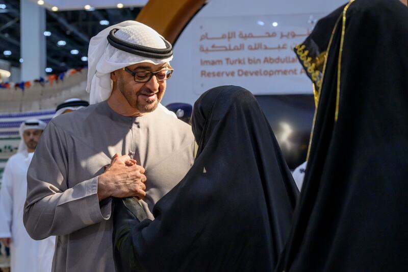 President Sheikh Mohamed speaks with an exhibitor during his tour of Adihex. Abdulla Al Neyadi / UAE Presidential Court
