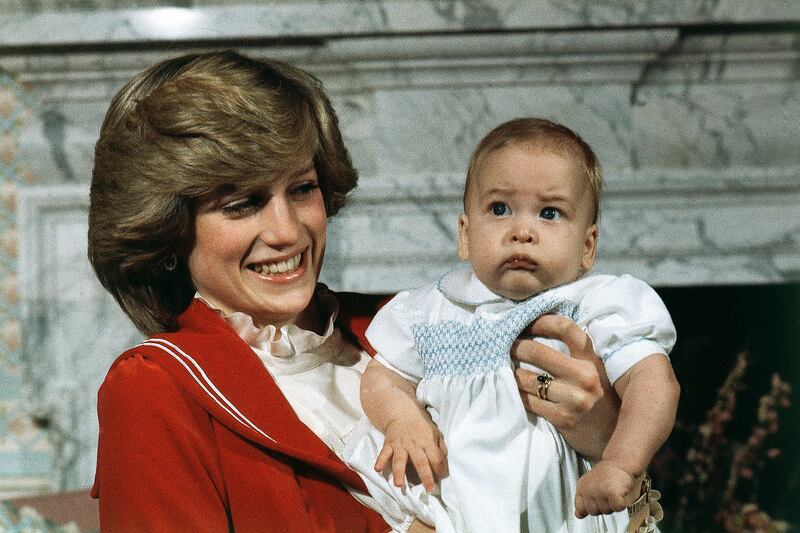 1982: A 6-month old Prince William with his mother Princess Diana at Kensington Palace in London. Prince William is celebrating his 40th birthday in 2022. Here 'The National' looks back at each of the years of his life. AP Photo