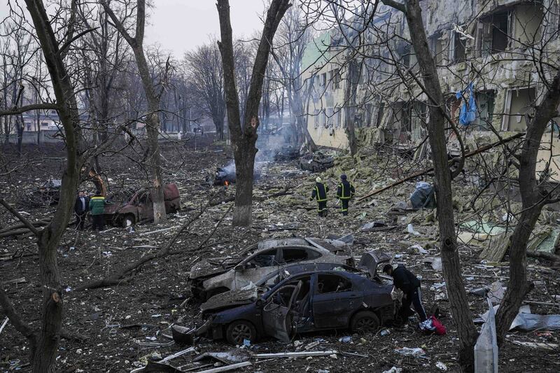 Ukrainian emergency employees work at a maternity hospital damaged by shelling in Mariupol. AP Photo