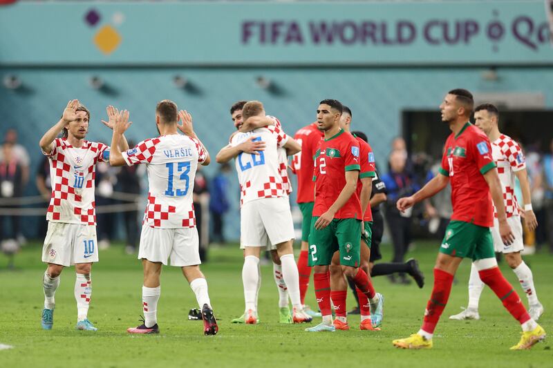Luka Modric (L) and Nikola Vlasic of Croatia celebrate after the 2-1 win. Getty