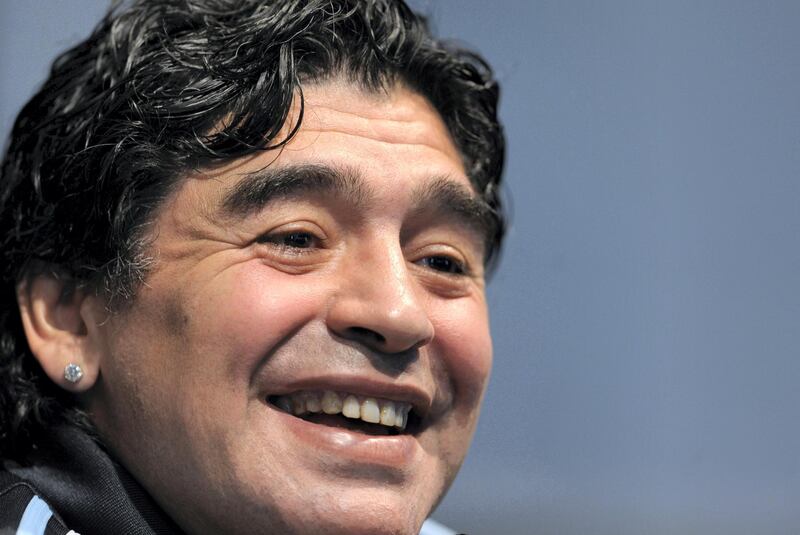 (FILES) In this file picture taken on January 16, 2009 Argentina's national football team coach Diego Maradona laughs during a press conference in Ezeiza, Buenos Aires. Argentine football legend Diego Maradona turns 60 on October 30, 2020.   / AFP / Juan MABROMATA
