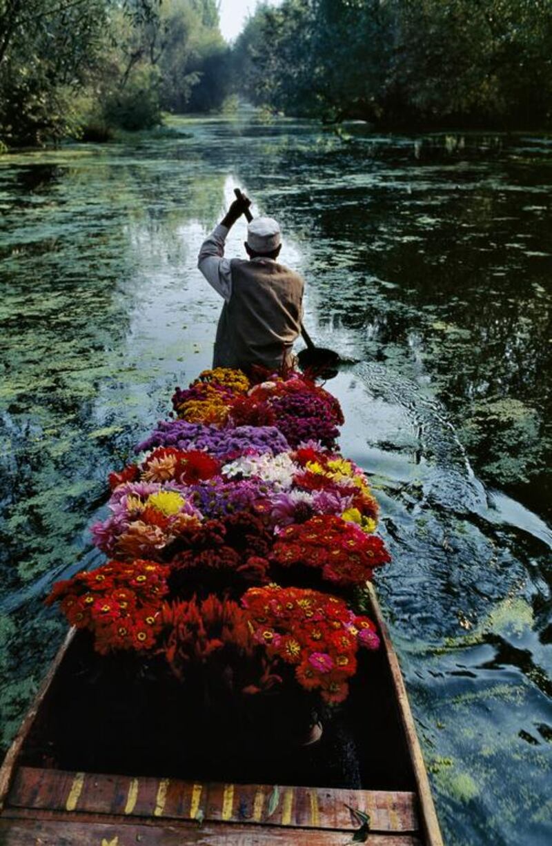 A flower seller at Dal Lake, Srinagar, Kashmir in 1996. McCurry travelled with the sellers for 2 weeks.