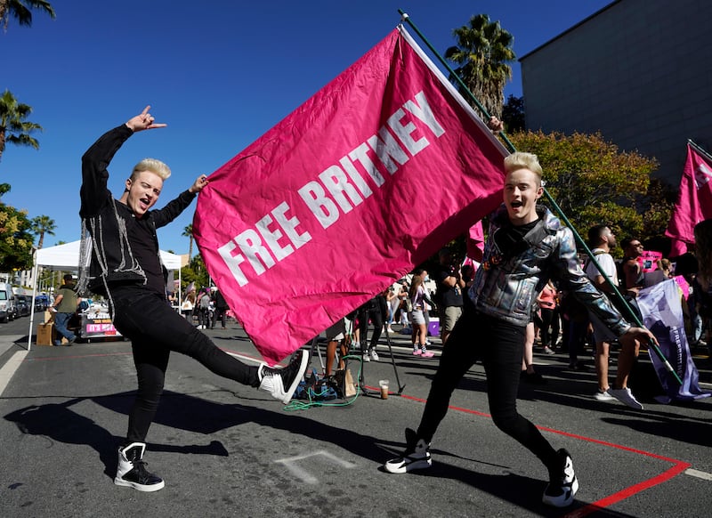 Twins Edward and John Grimes of Dublin, Ireland, with a 'Free Britney' flag outside the courthouse. AP