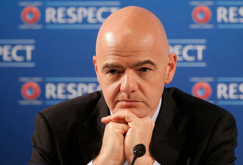 FILE - In this file photo dated Saturday, Feb 22, 2014, Gianni Infantino gestures during a press conference at the Acropolis Convention Centre in Nice, southeastern France.  FIFA President Gianni Infantino wants to team up with American, Chinese and Saudi Arabian interests to launch an expanded 24-team Club World Cup, played every four years starting in 2021, and a two-yearly global competition for national teams. (AP Photo/Lionel Cironneau, FILE)