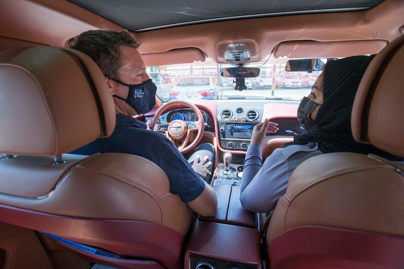 Dubai, United Arab Emirates - Driving instructor Zubeida inside a Bentley car instructing Nick Webster at the Emirates Driving Institute, Dubai.  Leslie Pableo for The National
