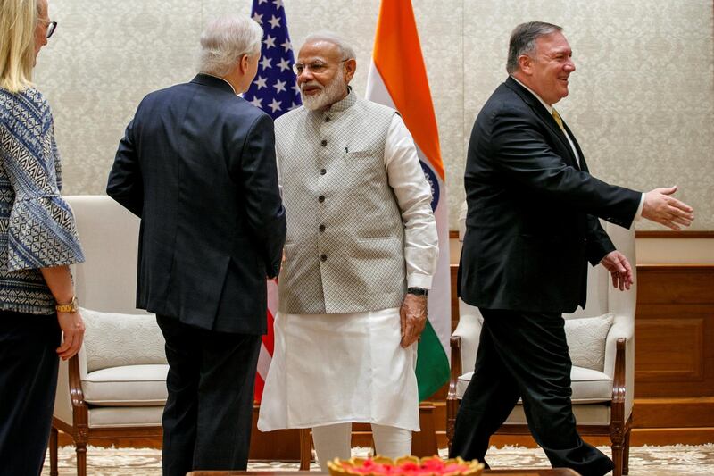 Indian Prime Minister Narendra Modi, centre, shakes hands with US Ambassador to India Kenneth Juster, left, as Mike Pompeo, walks to shake hands with the Indian delegation, at the start of their meeting at the Prime Minister's Residence in New Delhi, India. Reuters