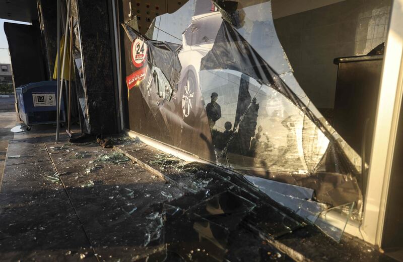 A Palestinian inspects the destruction following an Israeli airstrike in Gaza city. AFP