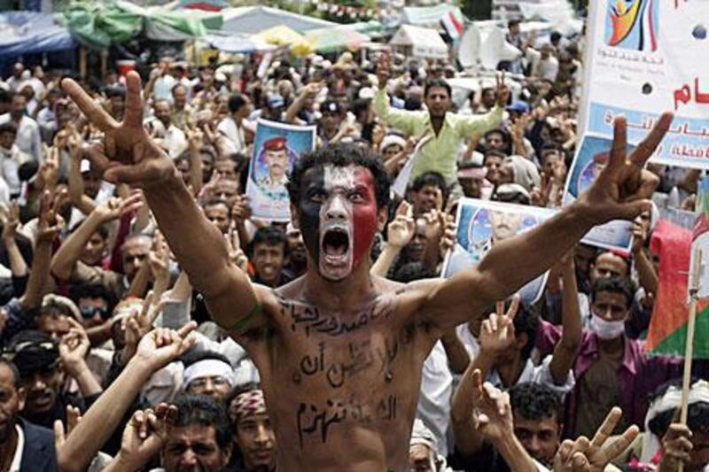 A protester joins a rally in the capital in September, with an slogan in Arabic on his chest that says: “Don’t think that youth will be defeated”.