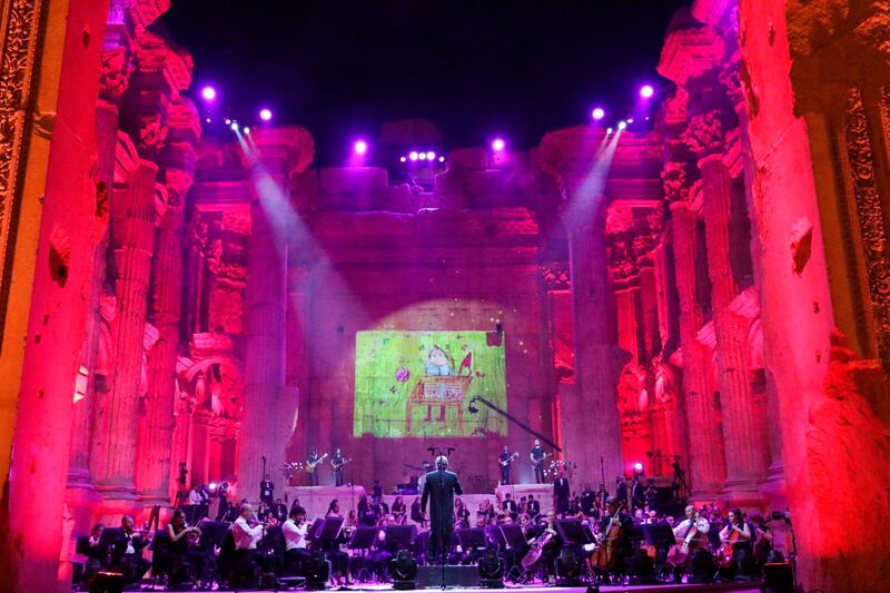 Maestro Harout Fazlian conducts rehearsals ahead of the Sound of Resilience concert inside the Temple of Bacchus at the historic site of Baalbek in Lebanon's eastern Bekaa Valley. AFP