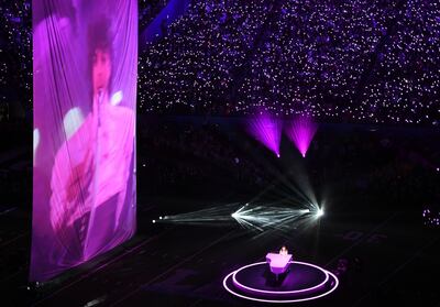 Singer Justin Timberlake pays tribute before a towering projection of Prince in the late singer's hometown during the Super Bowl LII Halftime Show at US Bank Stadium on February 4, 2018 in Minneapolis, Minnesota. / AFP PHOTO / ANGELA WEISS