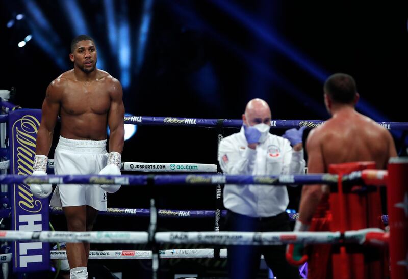 Joshua looks across as challenger Pulev takes a standing count.