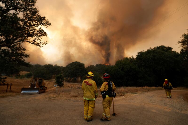 Fire firefighters monitor flames from the Detwiler fire in Mariposa, California. Stephen Lam / Reuters