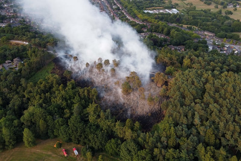 Firefighters respond to a large wildfire in woodland at Lickey Hills Country Park on the edge of Birmingham.  PA