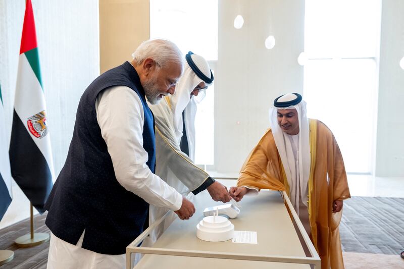 President Sheikh Mohamed and Indian Prime Minister Narendra Modi at the launch of a digital debit card during a reception in Abu Dhabi on Tuesday. Reuters