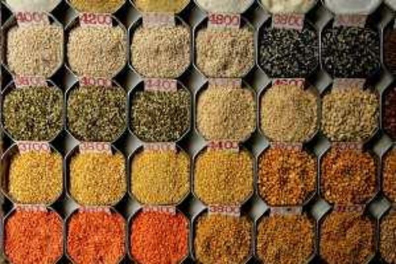 Selection of pulses and other food grains are on display outside a wholesale food supplier's shop in Mumbai, India, Saturday, April 26, 2008. A sharp rise in food prices has developed into a global crisis, U.N. Secretary-General Ban Ki-moon said Friday. (AP Photo/Gautam Singh)