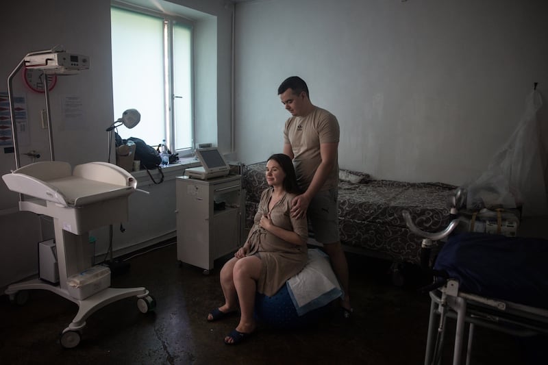 Volodymyr assists his wife Anastasia, as she has contractions before the birth of their first baby, at a maternity hospital in Zaporizhzhia, in September 2023. Ukraine’s birth rate since the start of the war the country's birth rate has plummeted by 28 per cent. Getty Images