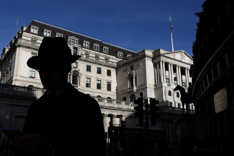 People walk past the Bank of England in London. Reuters
