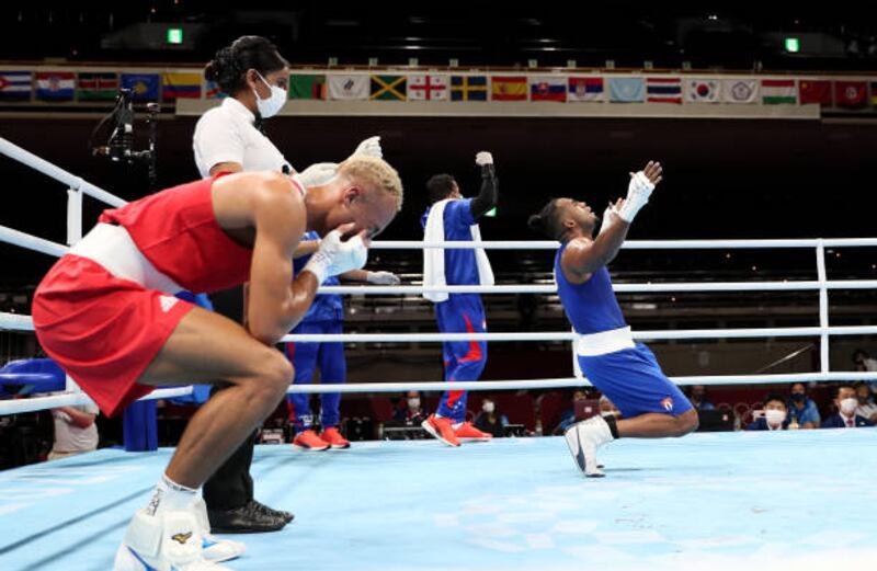 Arlen Lopez of Team Cuba celebrates after winning the gold medal against Benjamin Whittaker (red) of Team Great Britain during the Men's Light Heavy (75-81kg) final.